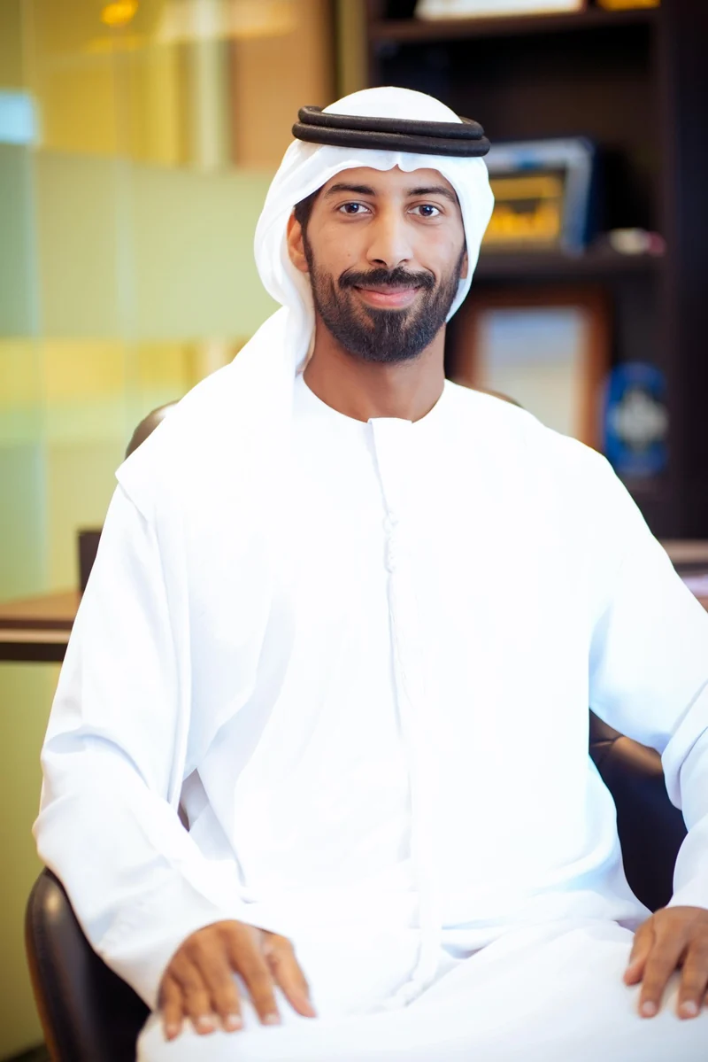 Haatem AlRamsi seated for a portrait